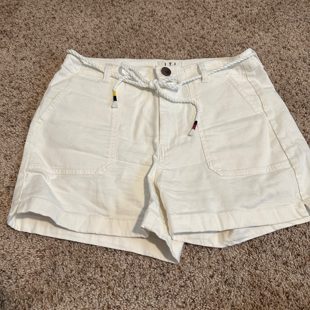 L.T.J White high-rise shorts with pockets and drawstring.